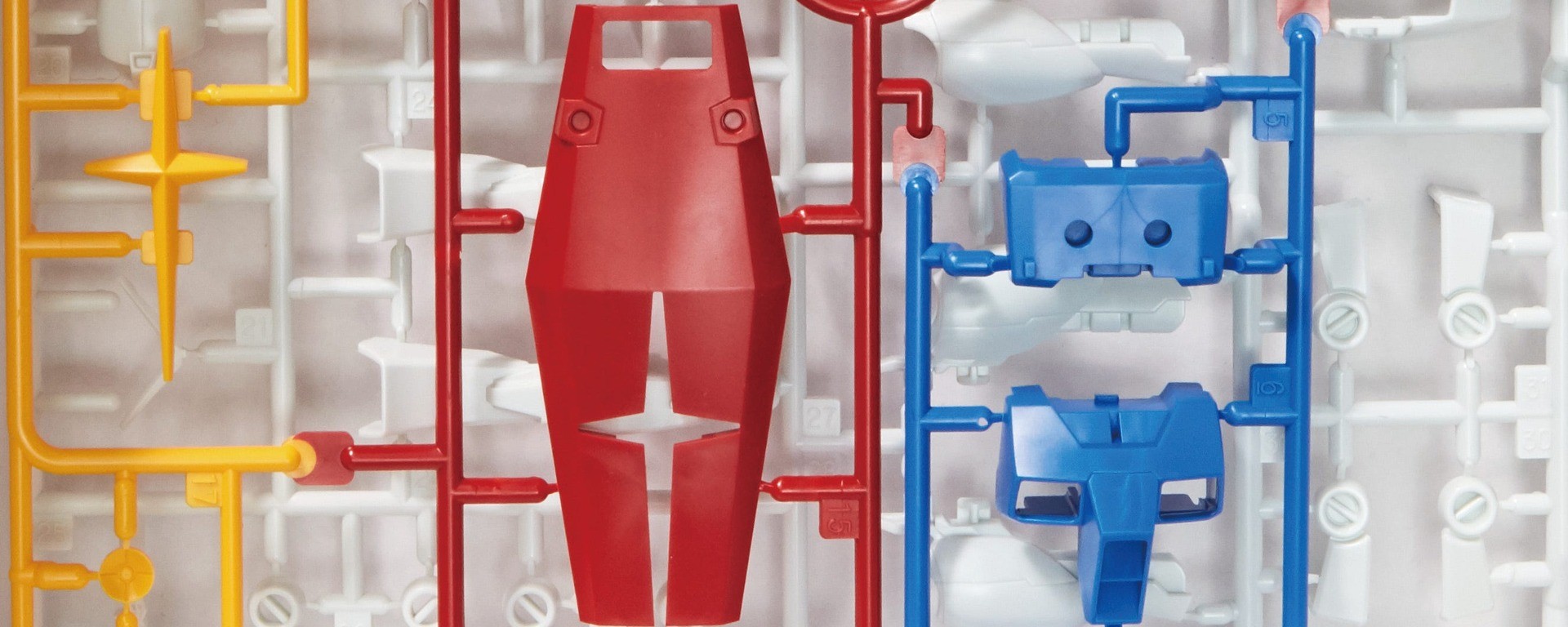 Photographie Bandai de pièces de maquette Gunpla et de leurs grappes