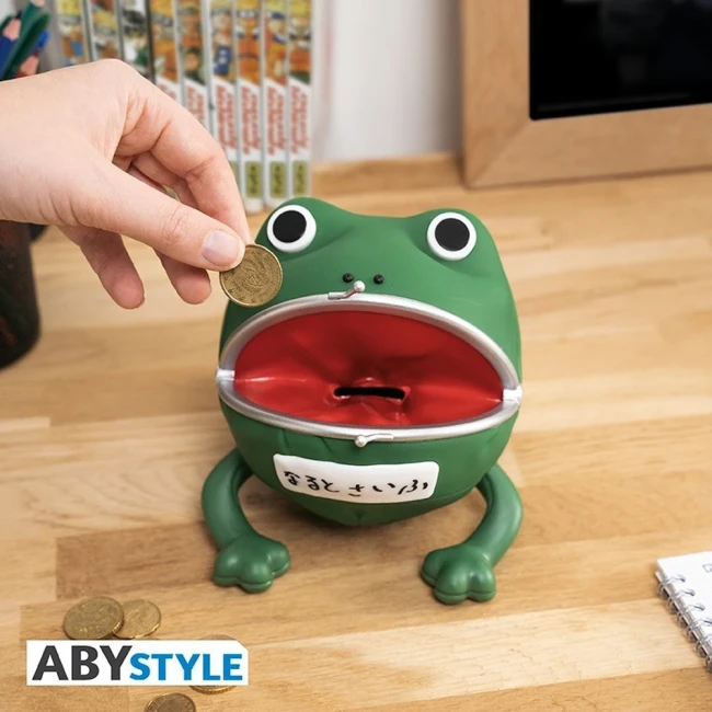 Tirelire Gama-chan ouverte avec une pièce présentée devant sa bouche