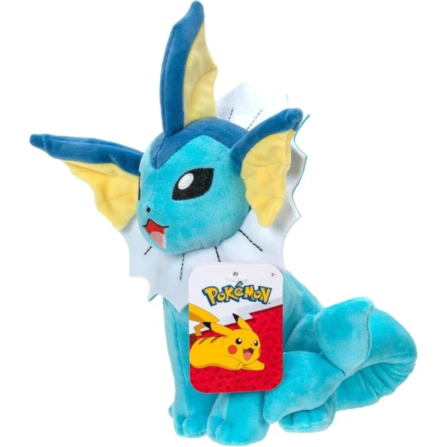 Peluche Pokémon - Peluche Aquali 20cm Peluche Pokémon Aquali officielle, assise avec un sourire, au pelage bleu avec une collerette blanche, des oreilles jaunes et une étiquette Pokémon rouge illustrée de Pikachu.