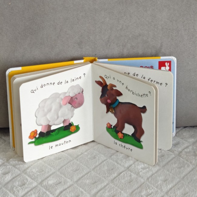 Pages du livre « La ferme » – Animaux de la ferme illustrés Pages intérieures du livre montrant le mouton et la chèvre, illustrations propres et nettes.