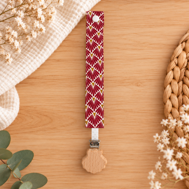 Attache sucette artisanale rouge et doré motif éventail