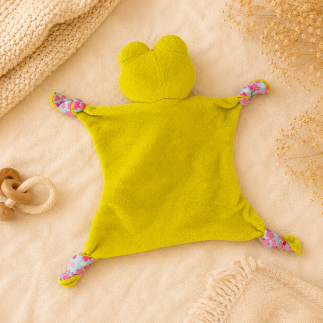 Dos du doudou grenouille plat bébé vert anis seconde main