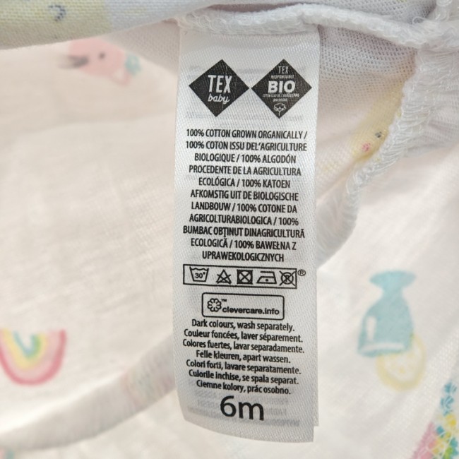 Étiquette coton bio TEX Baby – entretien et taille 6 mois Étiquette TEX Baby coton bio 6 mois – instructions d’entretien et composition multilingue