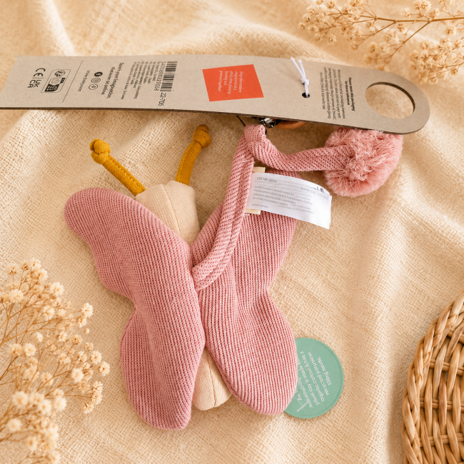 Jouet d'éveil papillon Trixie en coton biologique avec détails moutarde