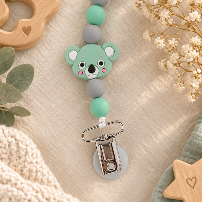 Pince métallique avec embout blanc et perles en silicone vert menthe et gris de l’attache-sucette koala vue arrière