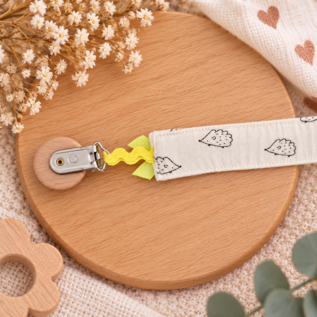 Nœud jaune de l'attache sucette artisanale Attache sucette artisanale avec nœud jaune et ruban décoratif