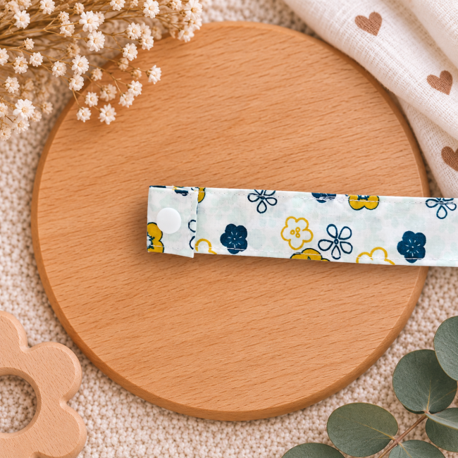 Tissu fleuri jaune et bleu de l'attache sucette artisanale