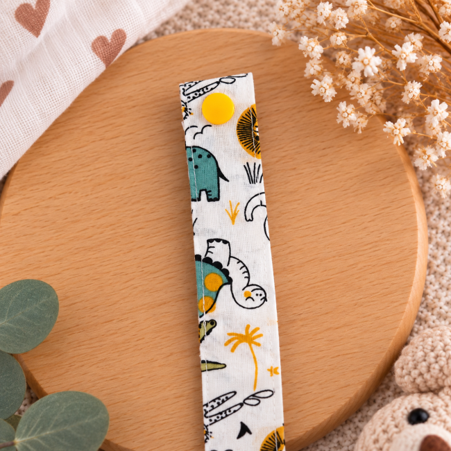 Pression jaune sur attache sucette en tissu aux motifs animaux