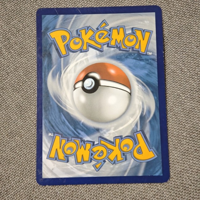 Carte Pokémon Métang 2023, PV 100, attaque Pisto-Poing. État seconde main soigné, idéale pour collection ou jeu.