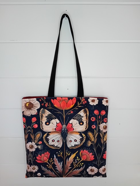 Tote bag artisanal « Papillon fleuri » avec motif papillon et fleurs, velours imprimé, suédine noire et anses noires
