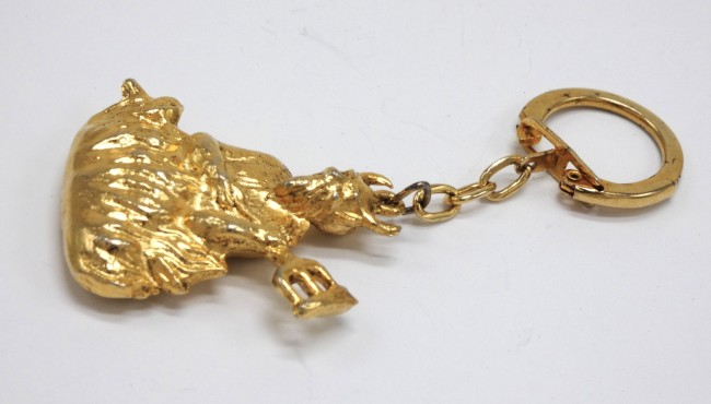 P1060185 Porte clé métal doré La grotte du diable