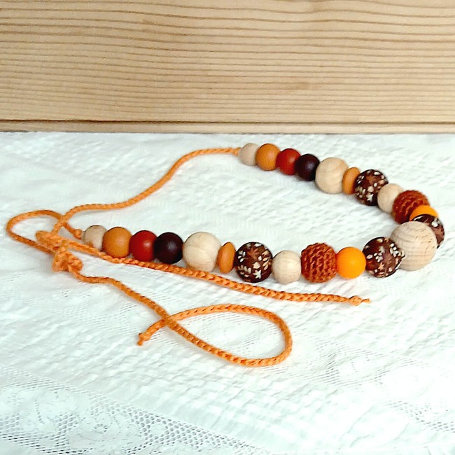 Collier pour faciliter le moment de l'allaitement, du biberon ou du portage