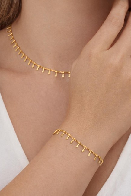 SOLEYA - Bracelet avec pampilles en acier inoxydable doré Bracelet fantaisie en acier inoxydable composé de pampilles pour un rendu chic et minimaliste