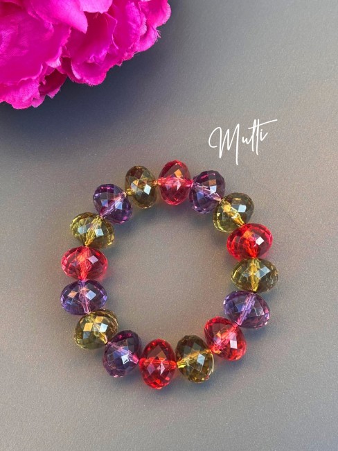 Bracelet bohème chic composé de grosses perles colorées facettées multi-couleurs rouge, vert kaki, violet évoquant le raffinement des palais italiens, sublimé par de délicates influences orientales.