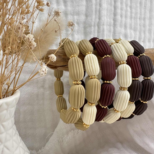 bracelets créateur perles acrylique de couleur striées et rondelles acier inox doré, élastique, atelier proche de Bordeaux bracelets créateur perles acrylique de couleur striées et rondelles acier inox doré, élastique, atelier proche de Bordeaux