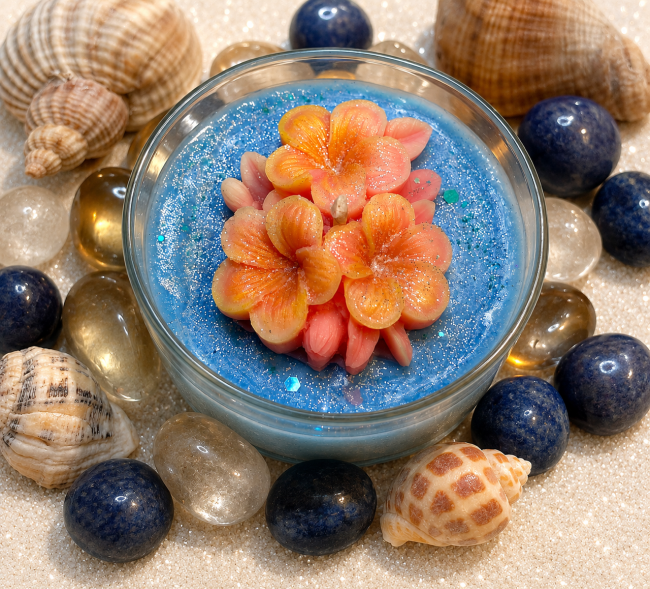 Bougie artisanale clémentine monoï thème mer et plage avec mer agitée et ses fleurs de monoï