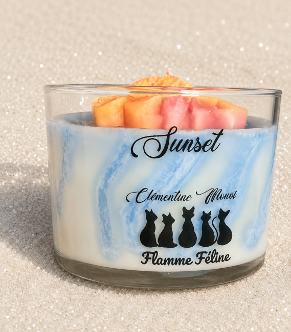 Bougie artisanale clémentine monoï thème mer et plage avec mer agitée et ses fleurs de monoï