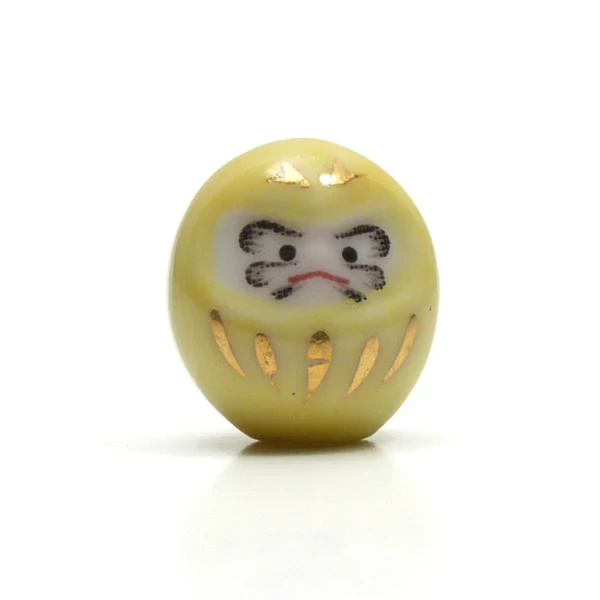 Figurines Tiny Lucky Daruma en porcelaine jaune chez Modern and Past