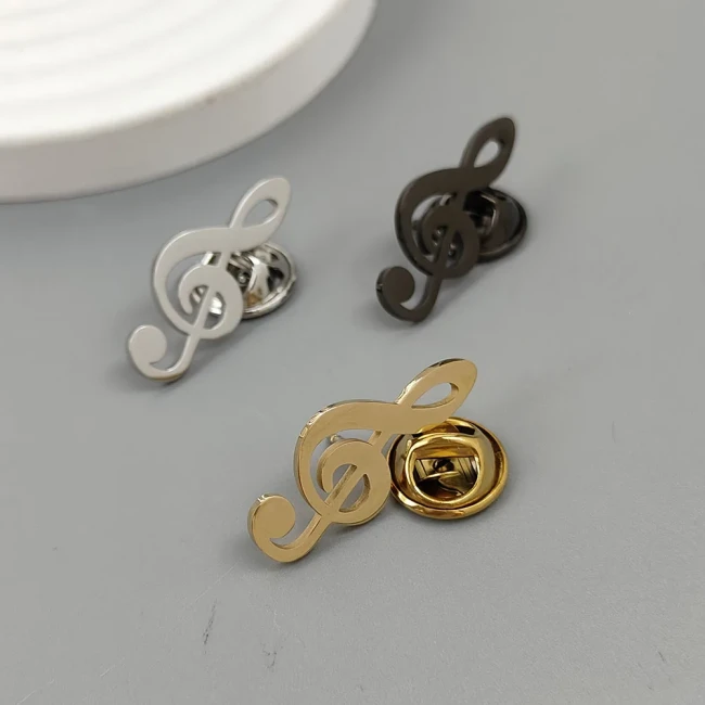 Présentation des trois broches clé de sol – Argent, Or et Noir