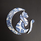 Tasse en porcelaine transformée en sautoir