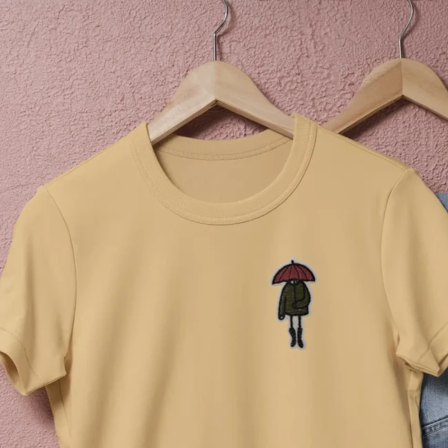 Patch brodé personnage au parapluie sur tee-shirt Patch silhouette sous un parapluie appliqué sur un tee-shirt