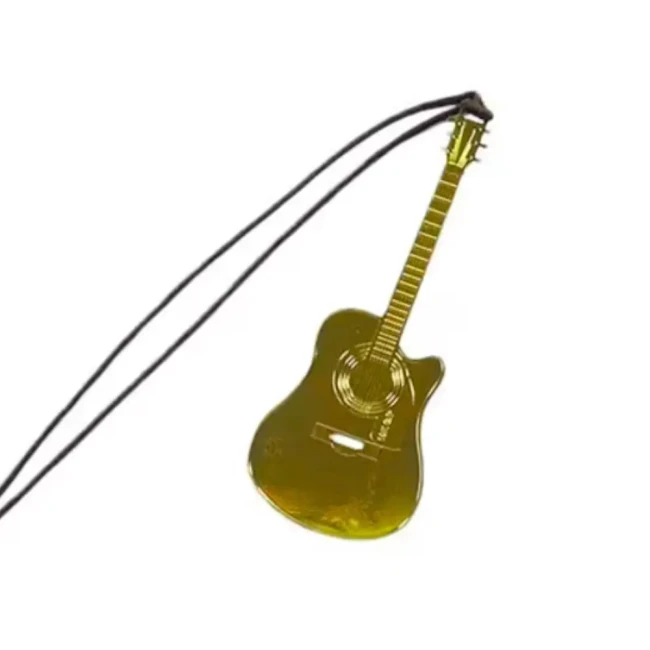 Guitare en métal doré – accessoire de lecture raffiné