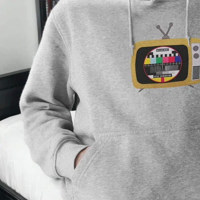 Motif télévision avec boutons rotatifs et antenne