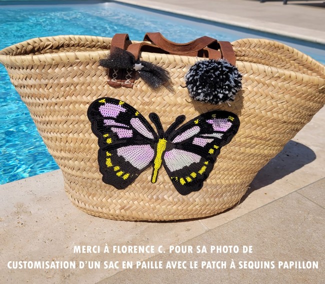Patch papillon brodé à sequins cousu sur un panier d’été