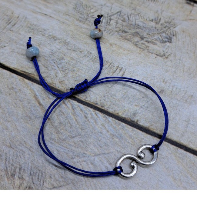 Bracelet ajustable en nylon avec connecteur infini en métal argenté et perle en céramique Bracelet ajustable en nylon avec connecteur infini en métal argenté et perle en céramique